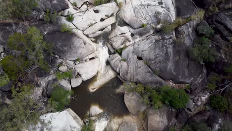 Aerial-Over-Rocks,-Waterfall-And-Boulders-At-Emerald-Creek-Falls