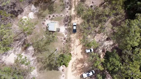 Aerial-Over-Car-Park-Entrance-To-Emerald-Creek-Falls-In-Cairns-Following-Car