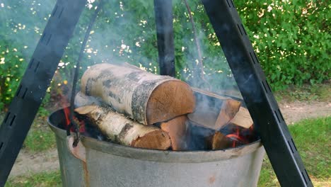 Traditional-old-cooking-style-burning-firewood-for-a-meal