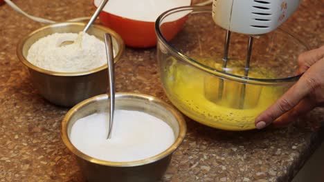 Cake-batter-mix-preparation-beating-eggs-closeup