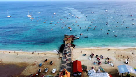 Aerial-shot-of-the-wooden-pier-of-Santa-Maria-on-the-island-of-Sal,-Cape-Verde