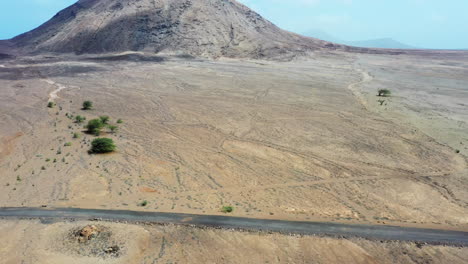 Aerial-shot-over-a-desert,-approaching-Monte-Leste,-on-the-island-of-Sal,-Cape-Verde