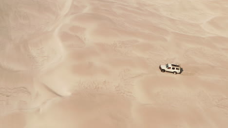White-fast-jeep-crossing-sand-dunes