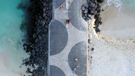 Aerial-top-down-shot-of-the-famous-Santa-Maria-wooden-pier,-on-the-island-of-Sal,-Cabo-Verde