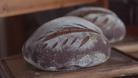 Freshly-Baked-Homemade-Bread-From-The-Oven---sliding-slowmo-shot