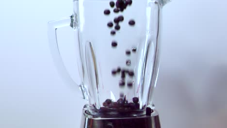 Blueberries-in-blender,-healthy-fresh-fruit-juice-preparation,-slow-motion