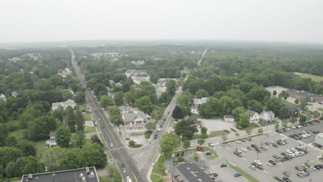 Aerial-Fly-Over-Drone-Footage-over-intersecting-road-in-Gorham-Downtown,-Cumberland-County-in-Maine,-USA