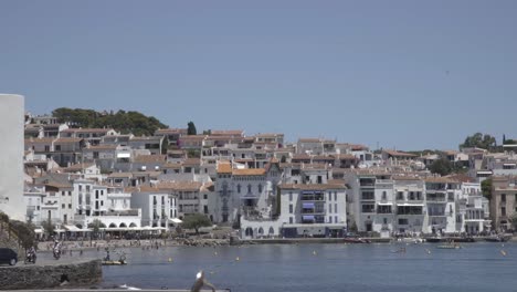 Coast-town-in-Costa-Brava,-Spain,-summer-vacations,-white-houses-at-the-background,-static-shot