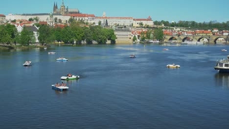 Panoramic-shot-of-Prague-and-Pedal-Boats-on-Vltava