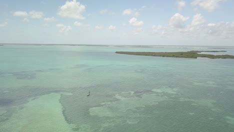 Drone-fly-over-reveal-at-Ascension-Bay,-Punta-Allen,-Mexico