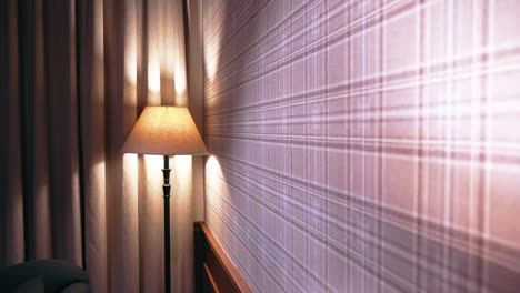 Pull-Back-Shot-of-A-Decorative-wall-in-a-luxurious-hotel-room-with-Night-Lamps-in-focus