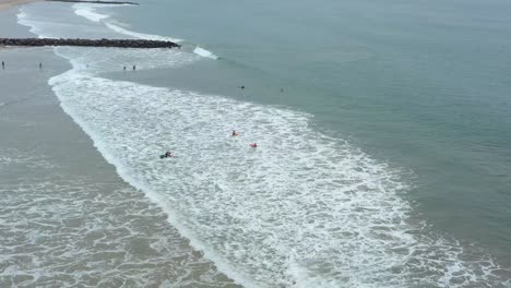 Kids-body-boarding-at-Ventura,-California-beach