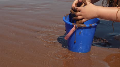 wet-sand-play-with-bucket