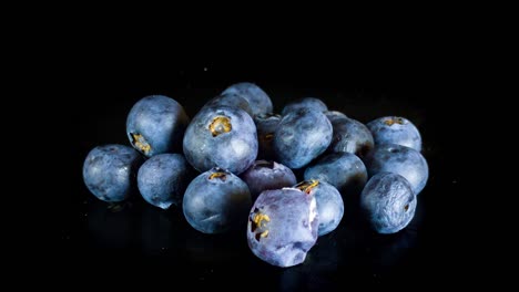 Pile-Of-Blueberries-Slowly-Perishing-In-Black-Background---Spoiled-Blueberries