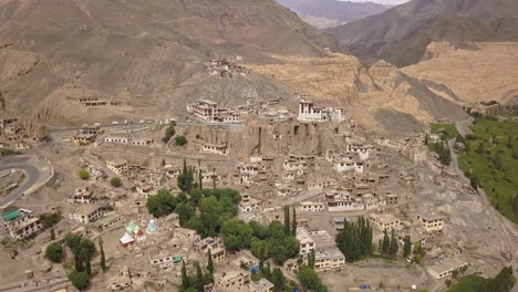 Aerial-View-Of-A-Lamayuru-Monastery-And-Village-By-The-Ladakh-Mountain-Range-On-Summer-In-Leh-District,-India