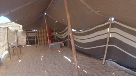 Inside-simple-Bedouin-tent-on-desert,-Arabian-camp