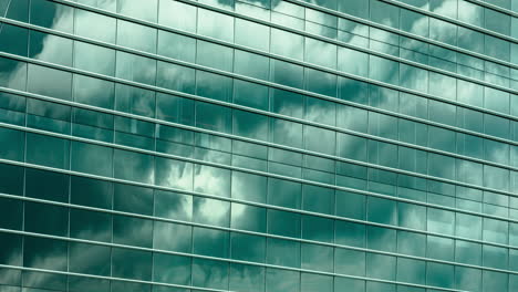 Timelapse-of-clouds-reflecting-off-a-windows-of-a-modern-office-building