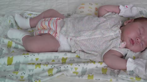 A-Cute-Baby-Girl-Sleeping-Peacefully-In-The-Crib---close-up
