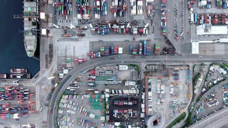 Hong-Kong-commercial-port-dock-and-holding-platform-with-thous-of-Shipping-Containers,-Aerial-view