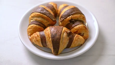 fresh-croissant-with-chocolate-on-plate