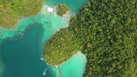 Top-Down-Aerial-View-of-Tropical-Sugba-Lagoon,-Turquoise-Sea-and-Green-Coastline-at-Siargao-Island,-Philippines