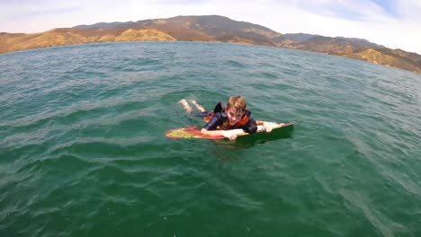 A-kid-knee-boarding-at-Castaic-Lake-in-California