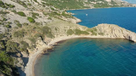 Beautiful-Bay-With-Crystal-Clear-Waters-Surrounding-Krk-Island-In-Croatia---Aerial-Shot