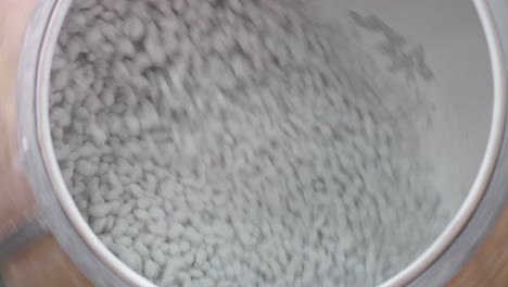 View-inside-a-large-spinning-vat-of-sugared-almonds-at-the-factory
