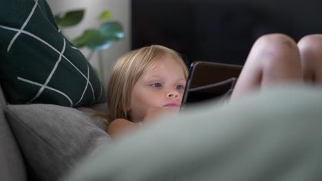 Young-Caucasian-Girl-at-Home-Watching-Digital-Tablet