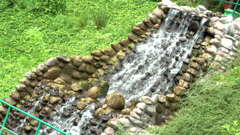 Angled-View-Of-Waterfall-Feature-At-Zoo
