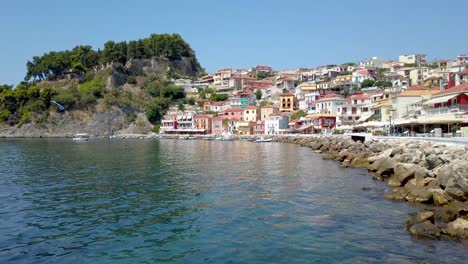 Historic-view-of-coastal-town-of-Parga,-Greece-on-a-clear-summer-day