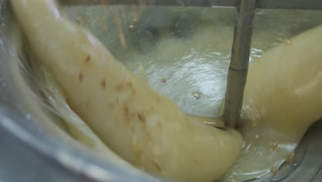 View-inside-a-mixing-vat-as-almonds-are-being-added-to-a-batch-of-Turkish-Delight