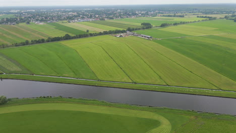 Aerial-of-beautiful-rural-landscape-with-green-fields-and-a-river