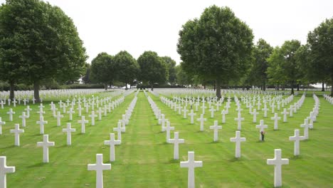 Wide-fake-drone-shot-of-rows-of-white-crosses-at-the-Netherlands-American-Cemetery-and-Memorial-in-Margraten,-Holland