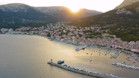 The-Beautiful-And-Peaceful-Resort-Town-Of-Baska-Near-The-Harbor-With-Boats-Ana-Yachts-Anchored-By-The-Calm-Sea-During-The-Golden-Hour-In-Krk-Island,-Croatia