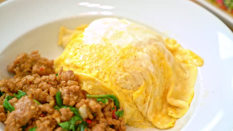 stir-fried-pork-and-basil-with-creamy-omelet-on-rice---asian-food-style