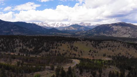 Aerial-shot-of-the-Estes-Park-in-Colorado-with-snowed-mountains-in-the-background