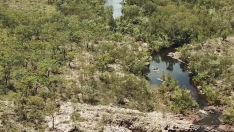 Drone-footage-flying-over-water-stream-and-forest-in-the-Northern-Territory