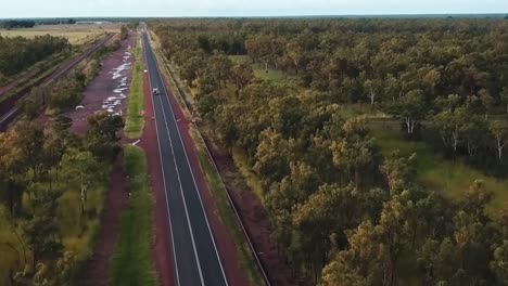 Drone-footage-over-Australian-country-road-with-car-driving