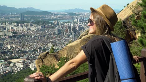 Lovely-Lady-Enjoying-The-Scenic-Seocho-gu-District-View-From-Gwanaksan-Mountain-In-South-Korea-On-A-Sunny-Day---medium-panning-shot