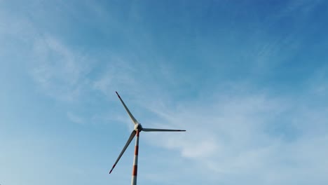 Windmill-from-a-wind-farm-in-India,-natural-renewable-energy,-clean-and-green-energy-to-power-homes---footage-for-presentation