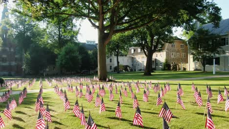 Flags-decorate-lawn-of-Moravian-Church-and-Linden-Hall-School-in-Lititz-Pennsylvania-during-dramatic-morning-sunlight