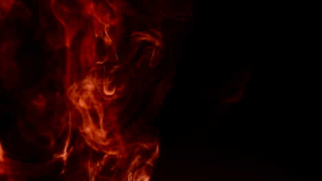 Flames-bursting-on-black-background.-4k-DCI-footage