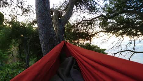 Happy-enjoying-relax-wild-nature-landscape-inspiring-views-swinging-hammock-at-Mediterranean-coast-epic-during-sunrise-hiking-adventure-lifestyle-medium-shot