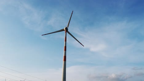 Windmill-from-a-wind-farm-in-India,-natural-renewable-energy,-clean-and-green-energy-to-power-homes---footage-for-presentation