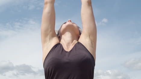 Close-up-of-attractive-woman-starting-yoga-exercise