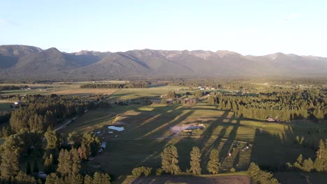 Drone-Flying-Over-The-Gorgeous-Landscape-Of-Kalispell-And-Bigfork-in-Montana,-USA-On-A-Sunny-Morning---aerial