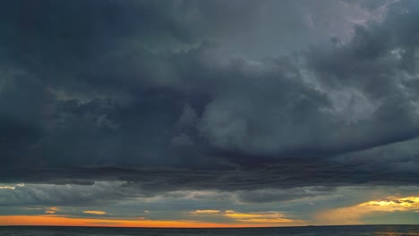 Time-lapse-of-the-sun-setting-behind-the-clouds-seen-from-a-beach-at-the-Croatian-Mediterranean-seaside