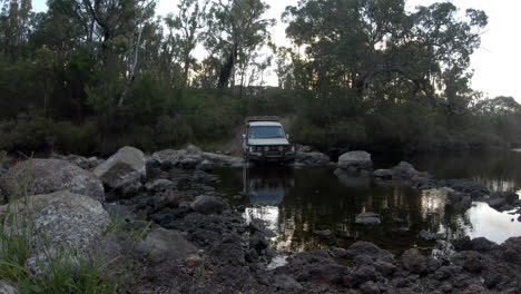4x4-off-road-vehicle-driving-through-rocky-and-stony-Water-river-in-nature,static