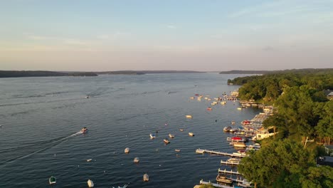 aerial-view-of-boats-anchored-on-the-cottage-shore-line-at-Lake-Geneva,-Wisconsin